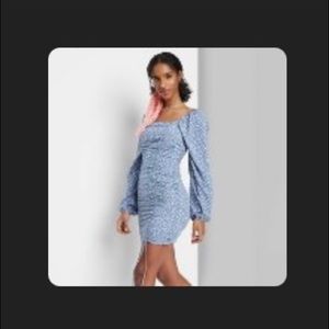 Blue dress that scrunches on the side to perfectly hug the curves!